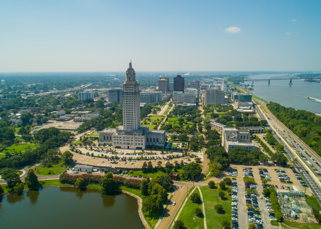 An aerial view of downtown Baton Rouge with the Louisiana State Capitol in the foreground.