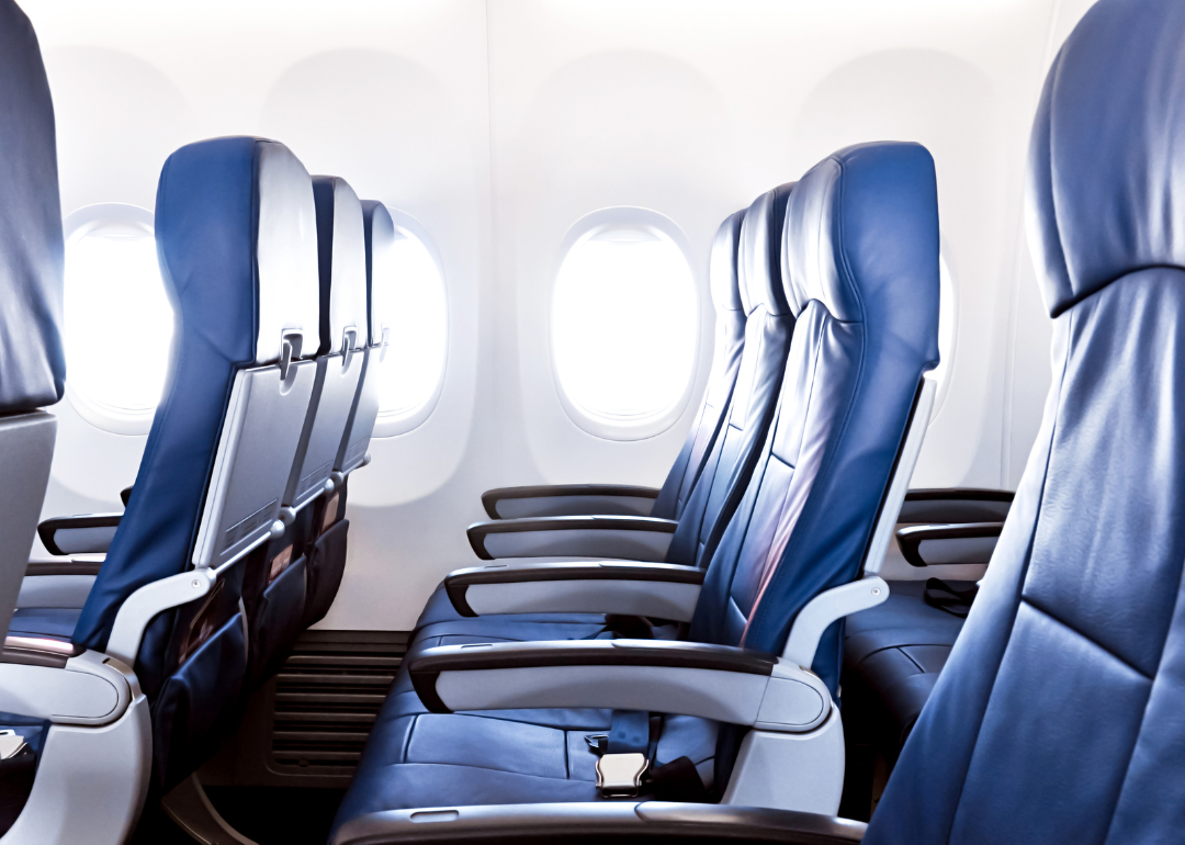Empty airplane seats in the main cabin.