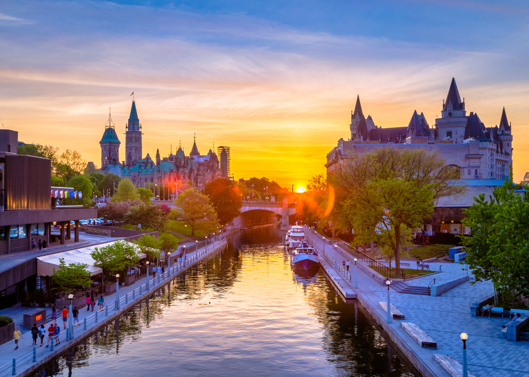 Ottawa city buildings and Rideau canal from Mackenzie King bridge during sunset