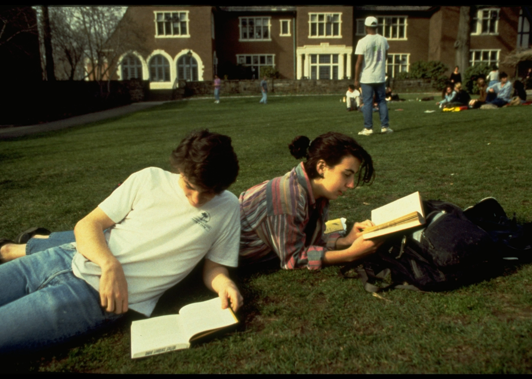 Students lounging and reading on lawn on the campus of Sarah Lawrence College in January 1993.