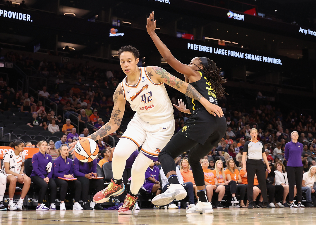Brittney Griner, #42 of the Phoenix Mercury, handling the ball against Chiney Ogwumike, #13 of the Los Angeles Sparks, during the first half of a WNBA game at Footprint Center on May 12, 2023, in Phoenix, Arizona.