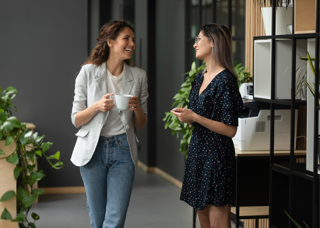 Two people chatting in an office.