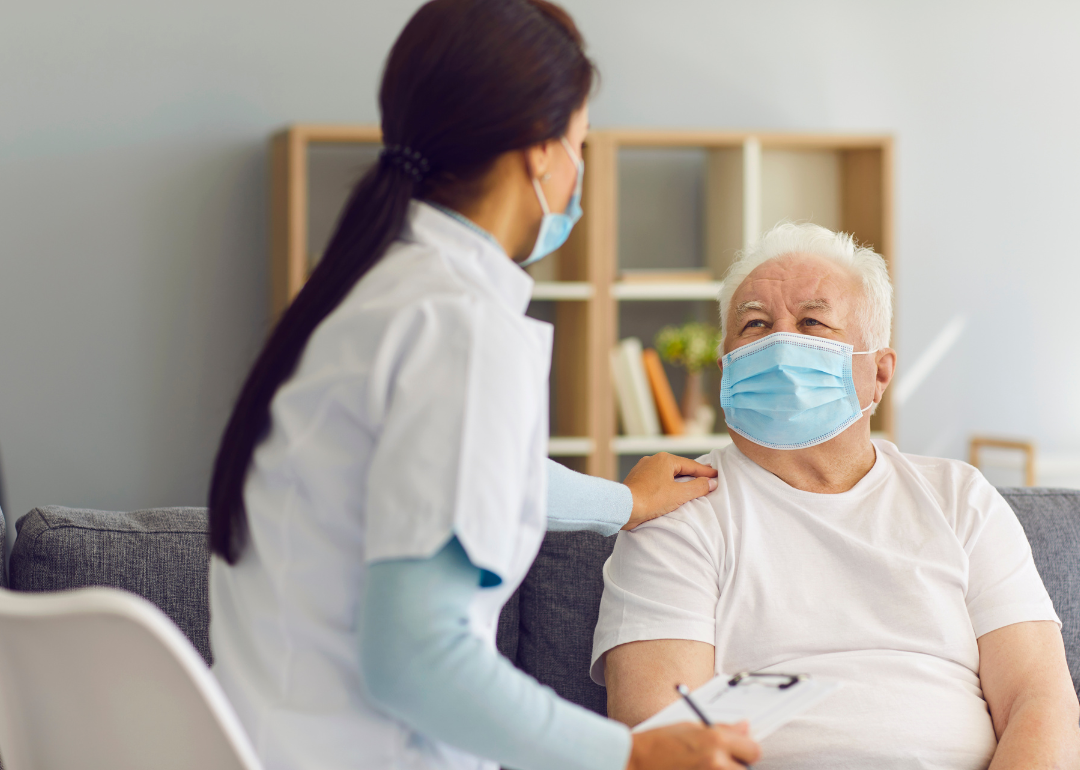 A doctor visiting a patient at home.