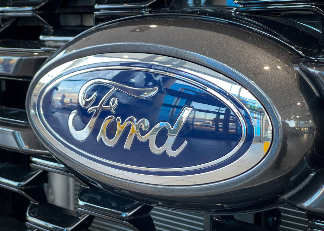 The logo of the Ford Motor Company displayed on the front grille of a Ford Ranger.