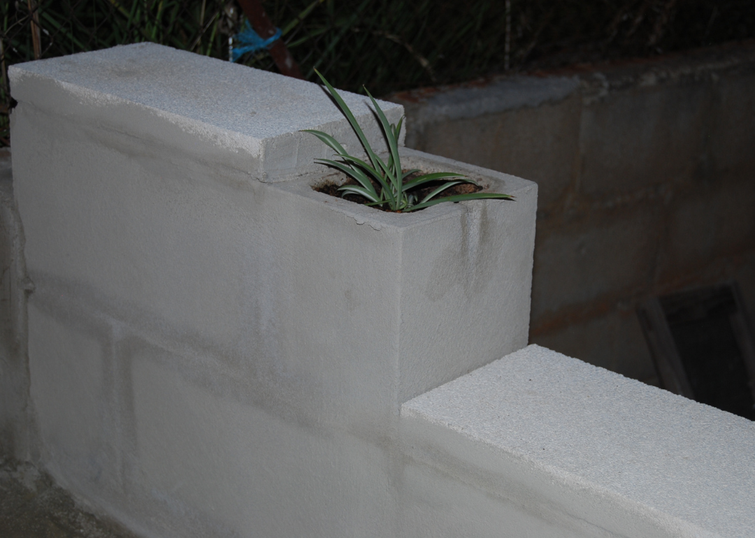 A cinder block planter with storage