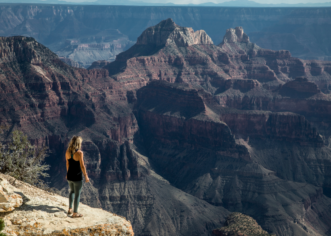 A woman overlooking the Grand Canyon North Rim.