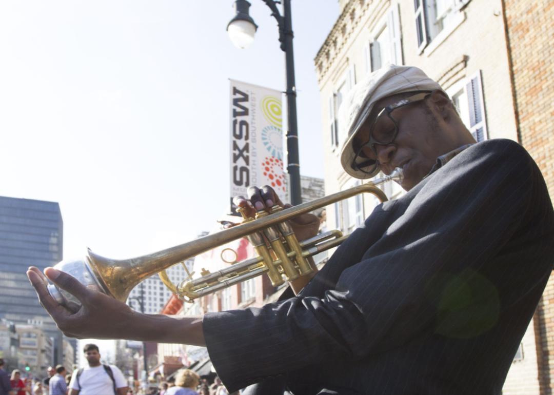 A street musician playing the trumpet in Austin.