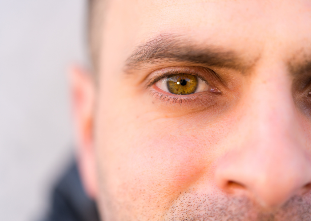 A man's eye looking directly into the camera