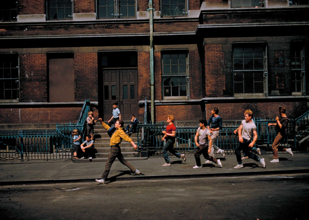 Guys dancing down the street on the set of the film.