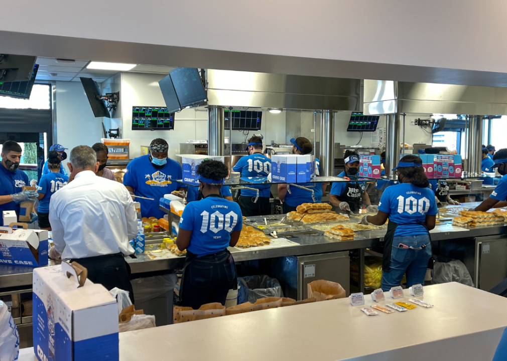 Employees making burgers inside a White Castle.
