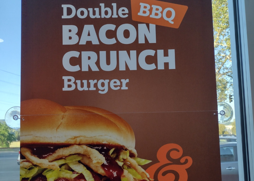 A poster for the BBQ Bacon Crunch Burger at A&W.