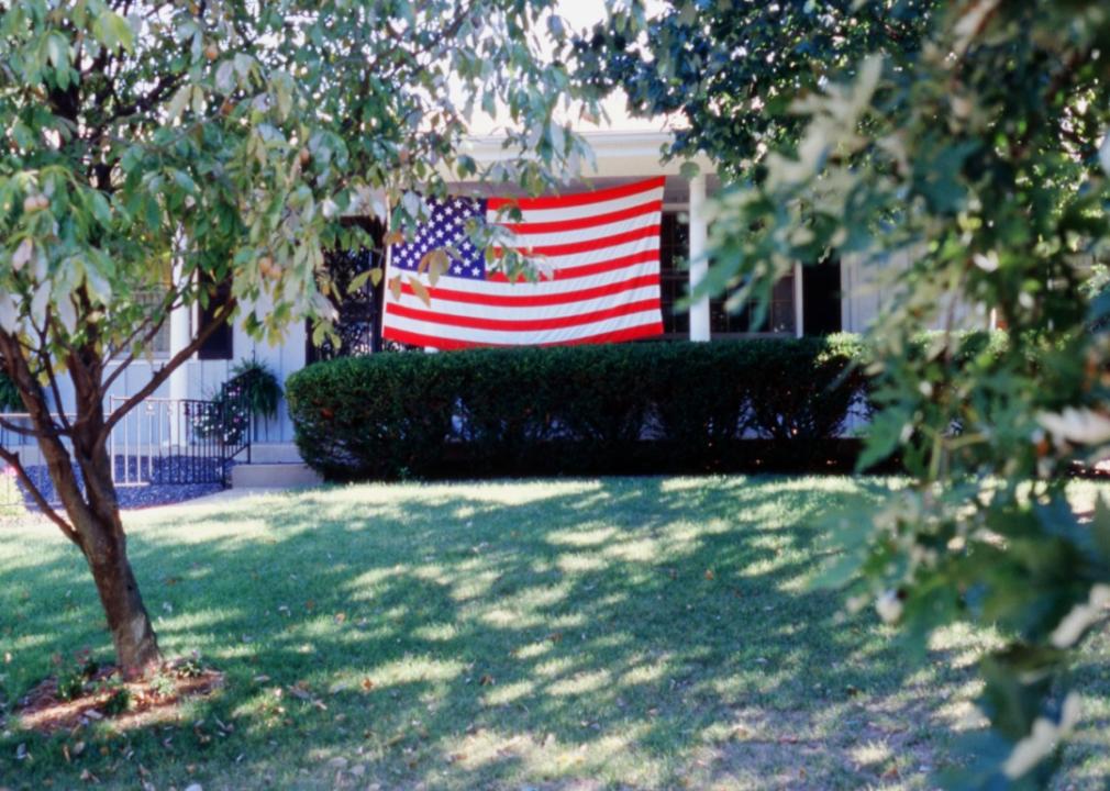 An American flag in front of a home.