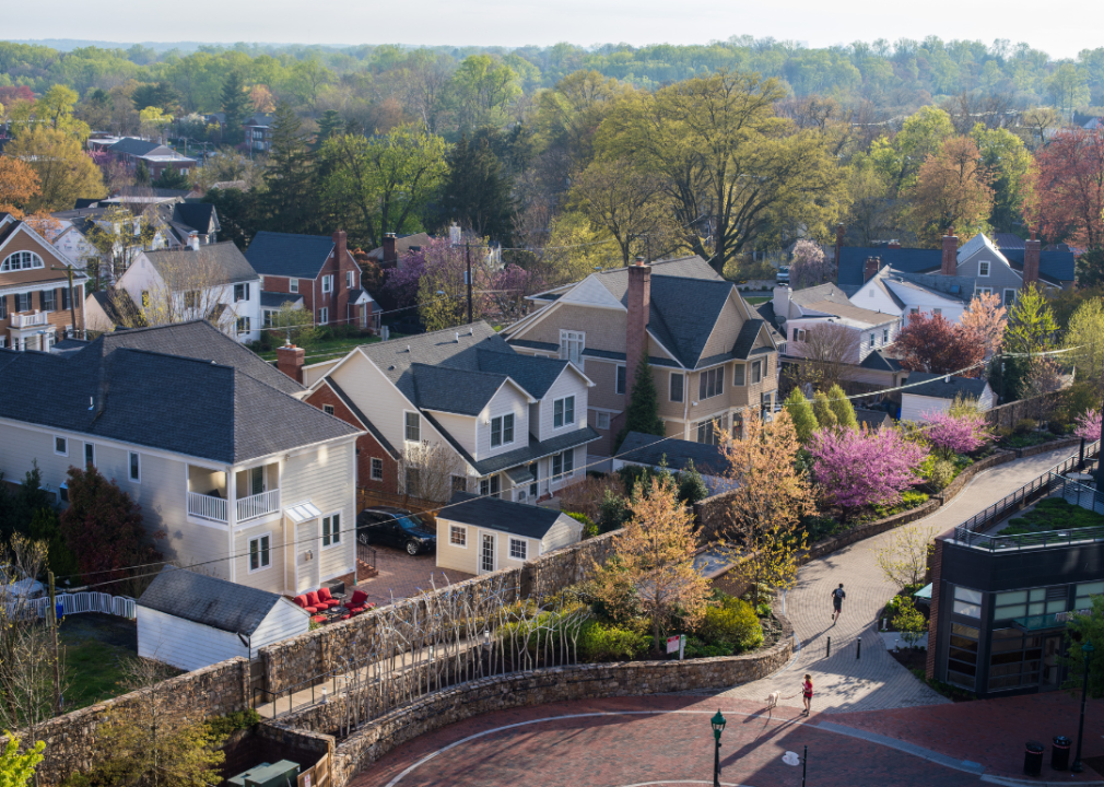  An aerial view of Chevy Chase, a wealthy suburban neighborhood in the outskirts of Washington D.C. The sun sets behind the residential homes in the spring.