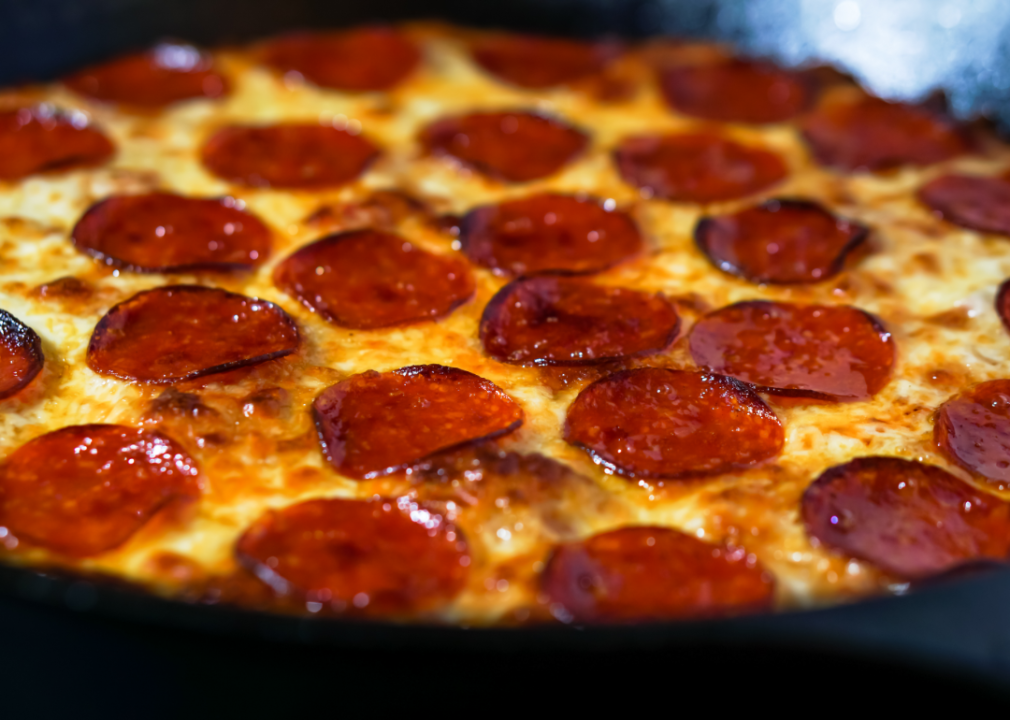 Closeup of Chicago-style deep dish pepperoni pizza.
