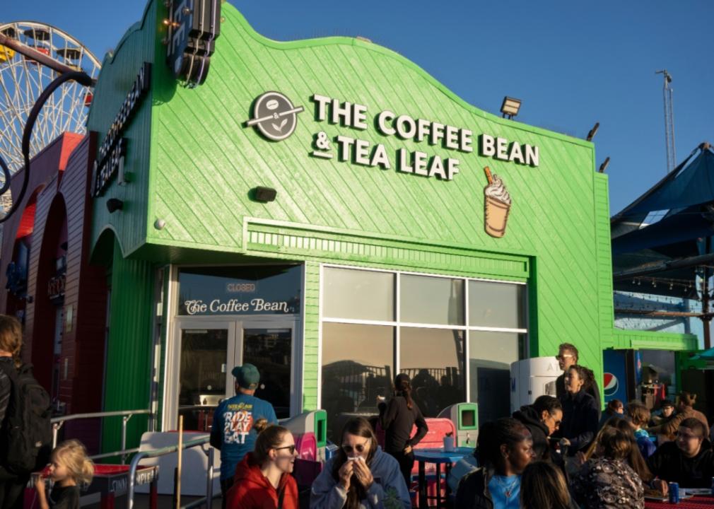 People sat outside The Coffee Bean & Tea Leaf.