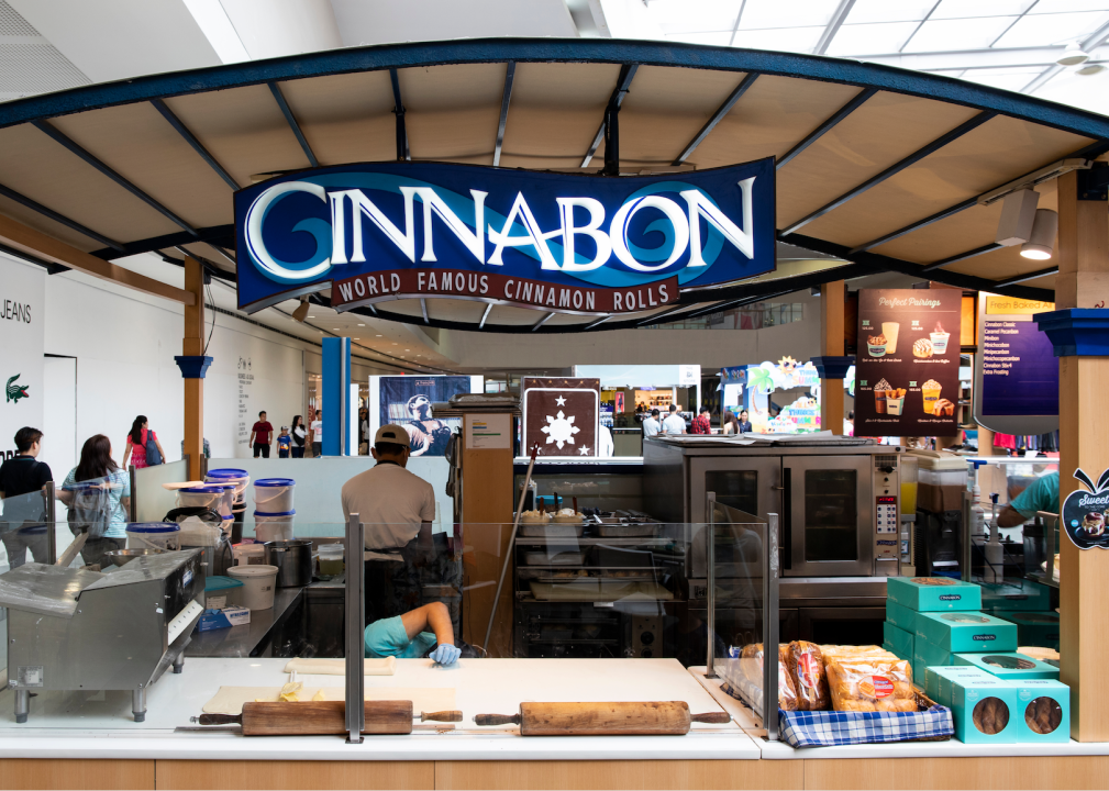 A Cinnabon stand in what looks like a mall or airport.