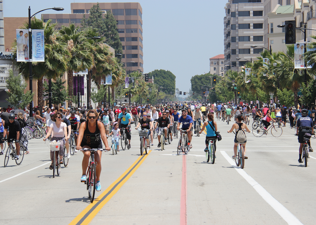 A crowded street of people on bicycles.