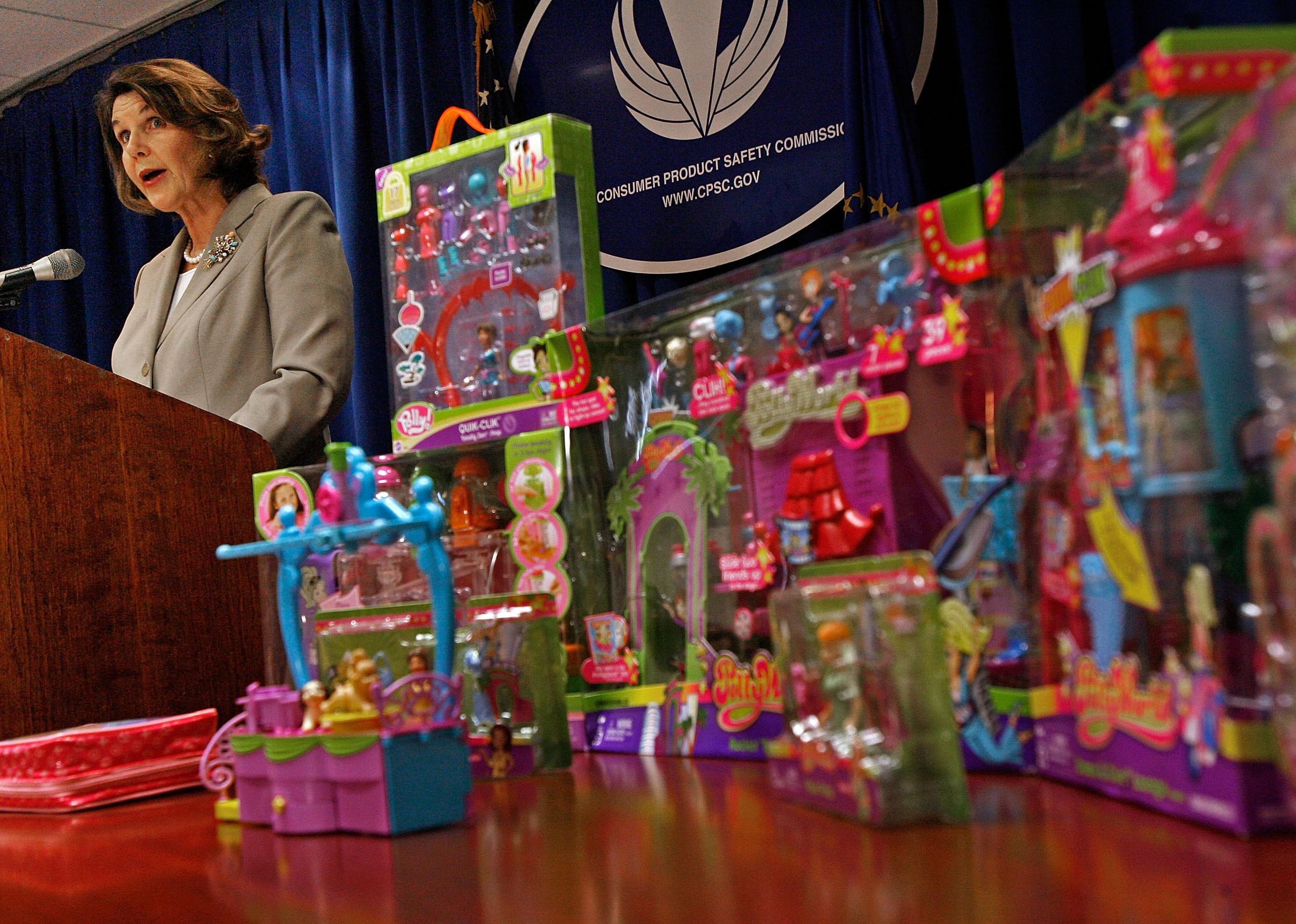 U.S. Consumer Product Safety Commission acting Chariman Nancy Nord announces the recall of millions of toys with many boxes of toys placed on a table next to her podium.