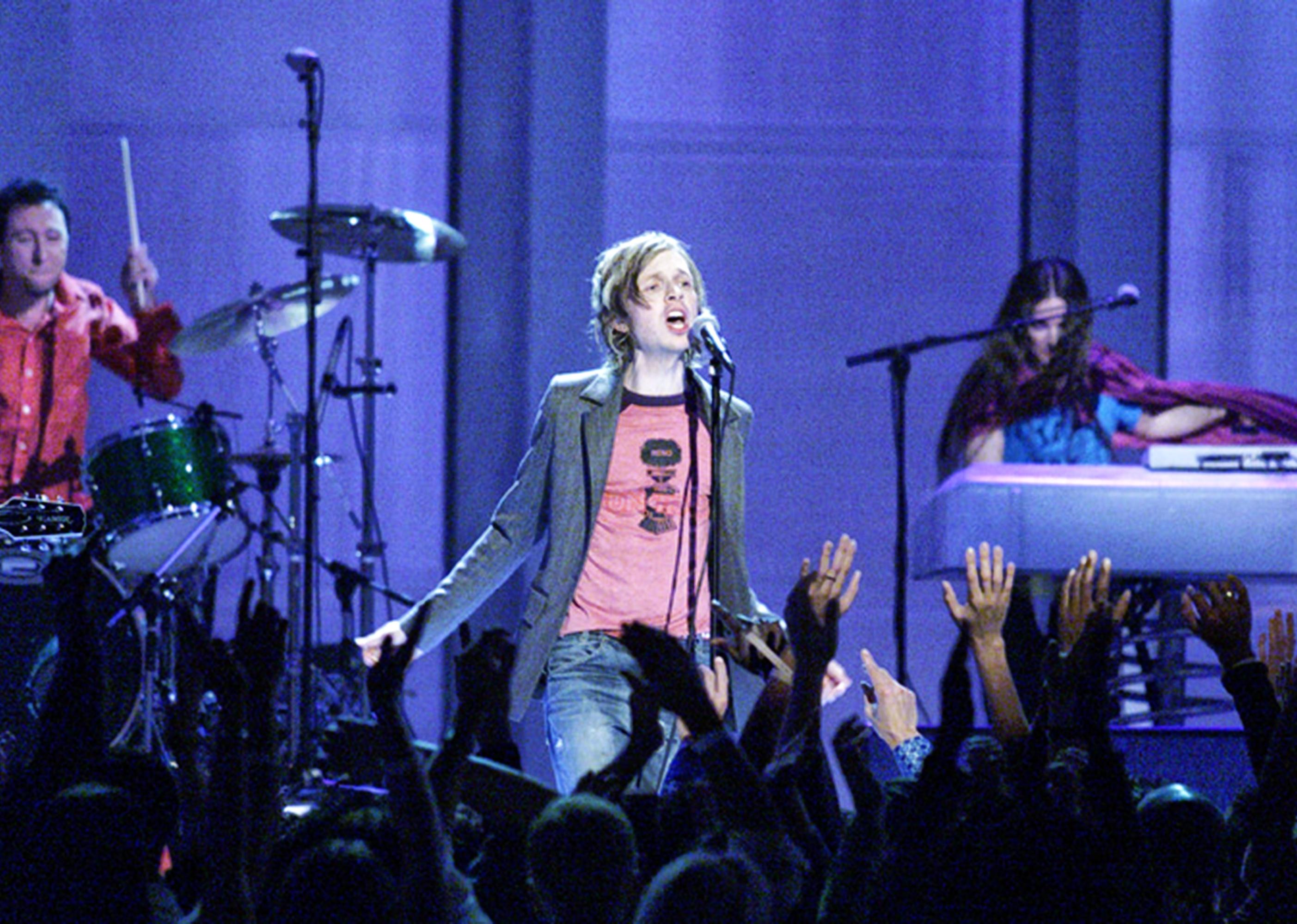 Beck performs on stage