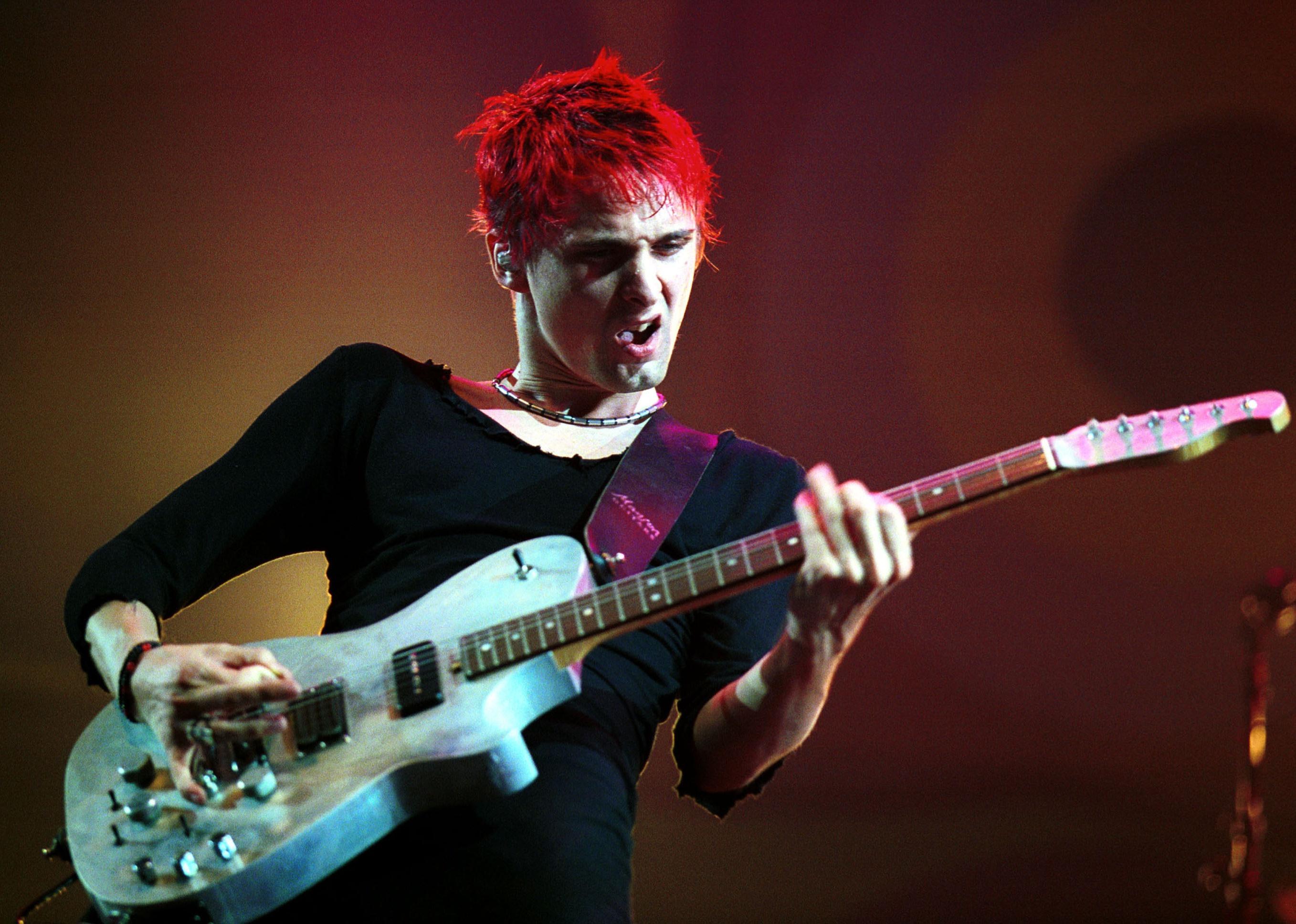 Muse's Matt Bellamy plays a guitar