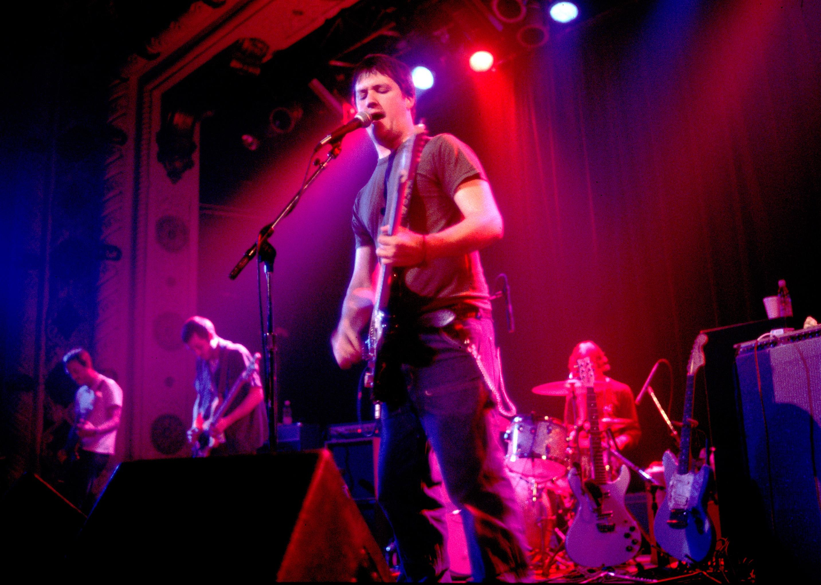 Modest Mouse perform at a concert
