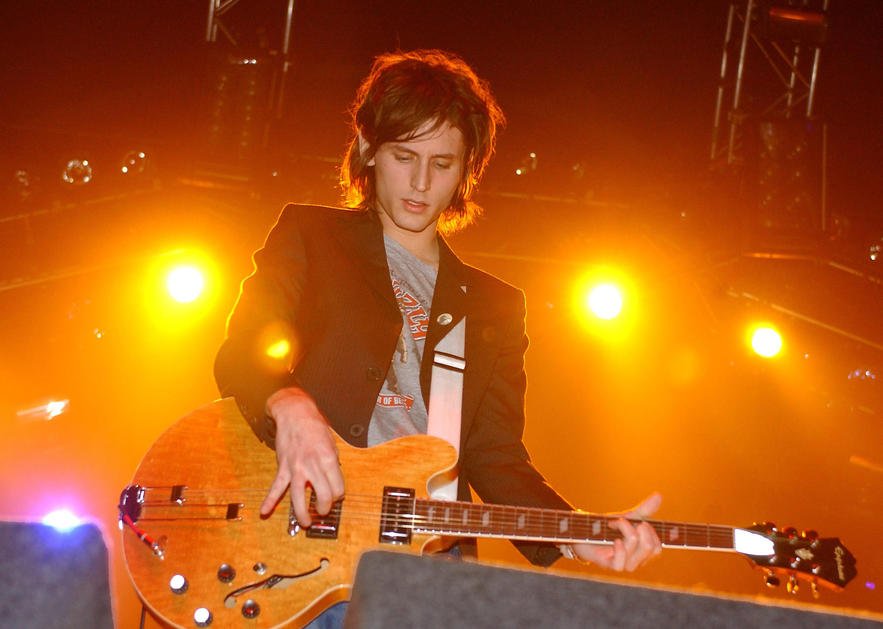Nick Valensi of The Strokes plays the guitar