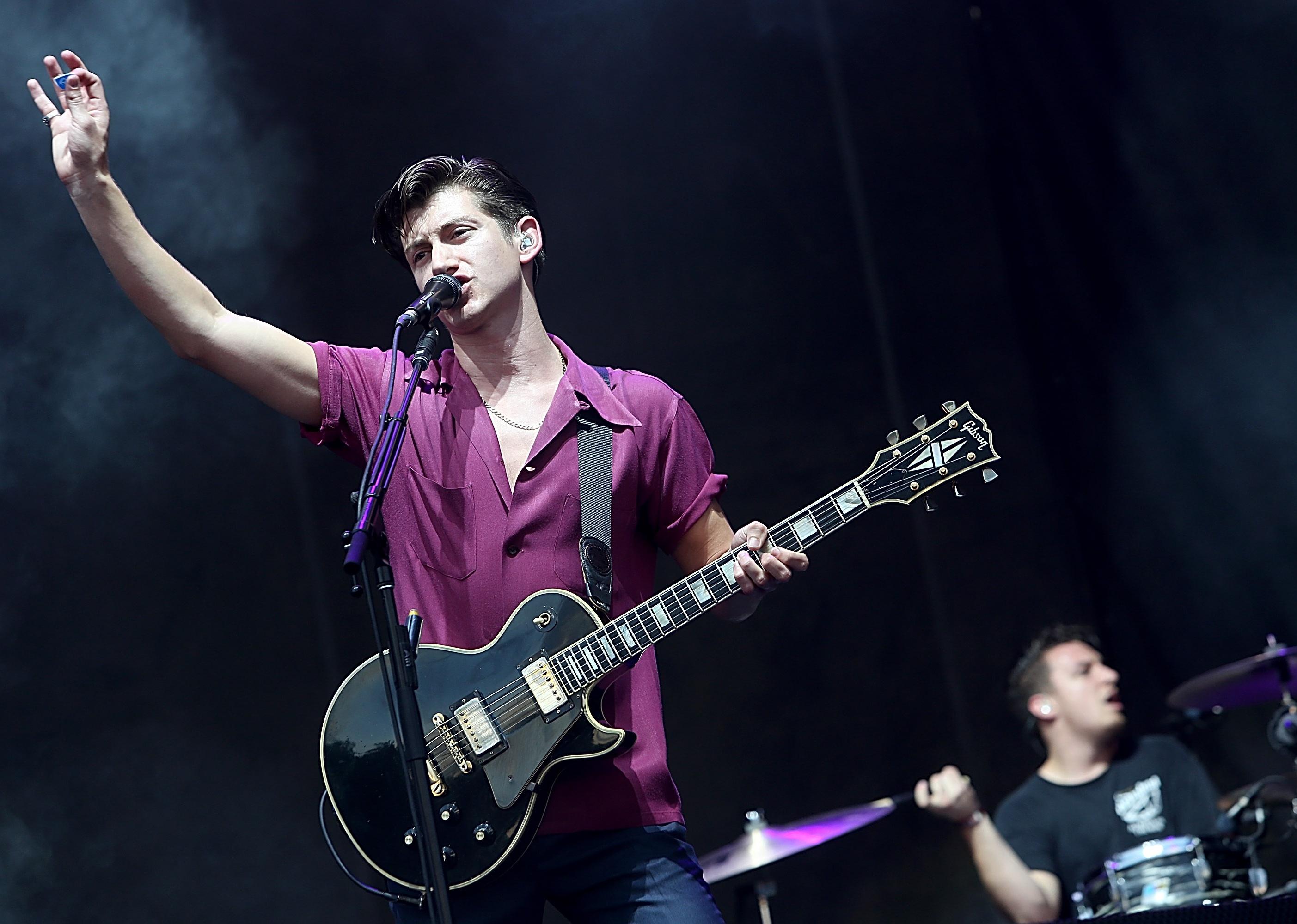 Alex Turner of Arctic Monkeys sings a song