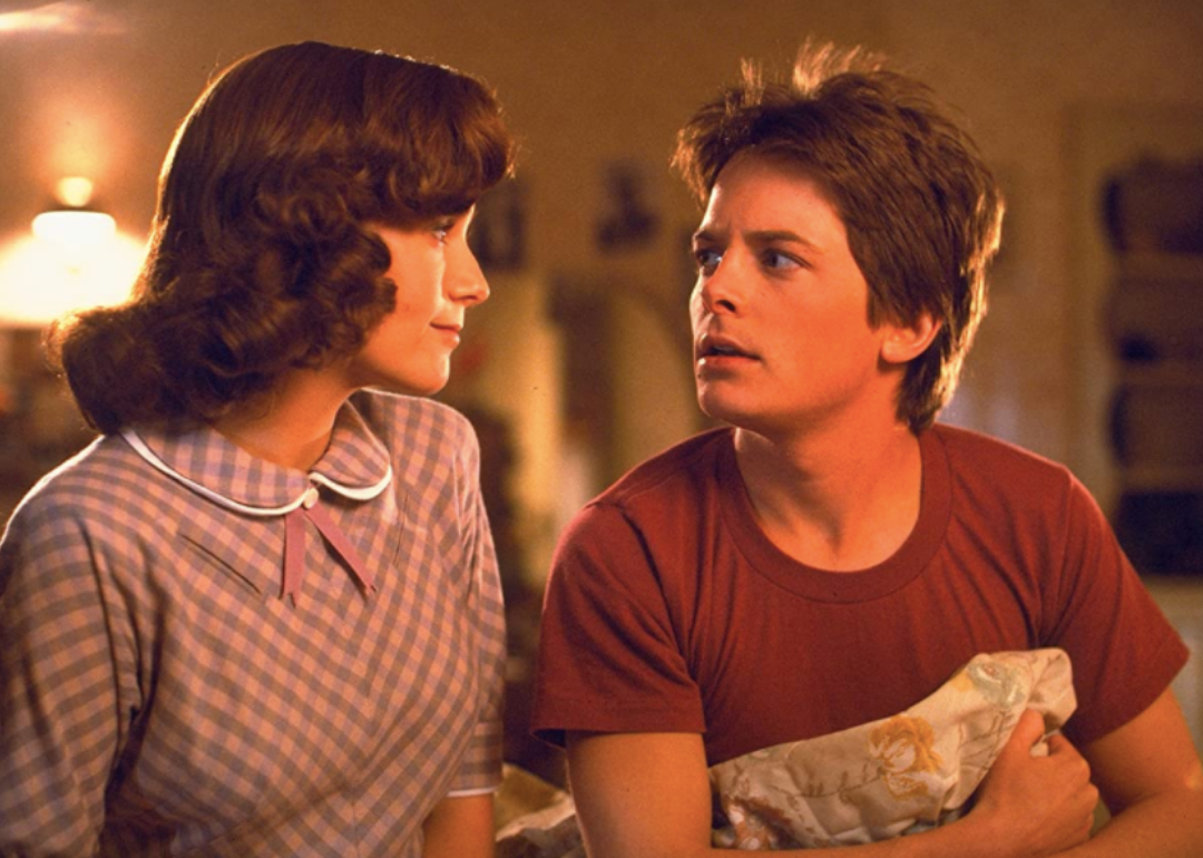Michael J. Fox and Lea Thompson looking at each other.