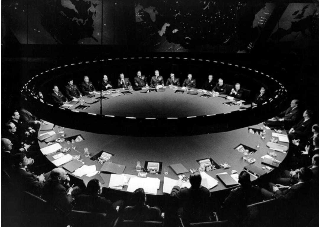 A large group of people seated at a round table.