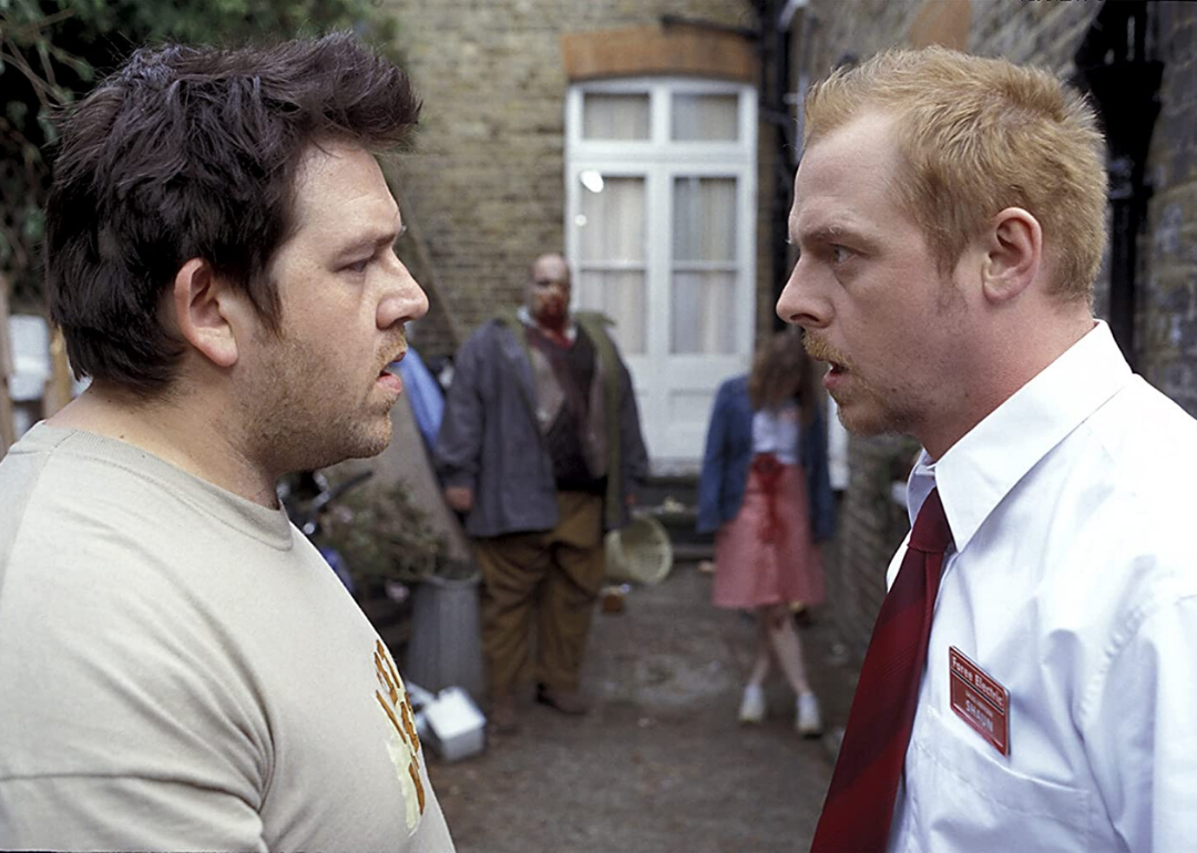 A closeup of Simon Pegg and Nick Frost staring at each other intently.
