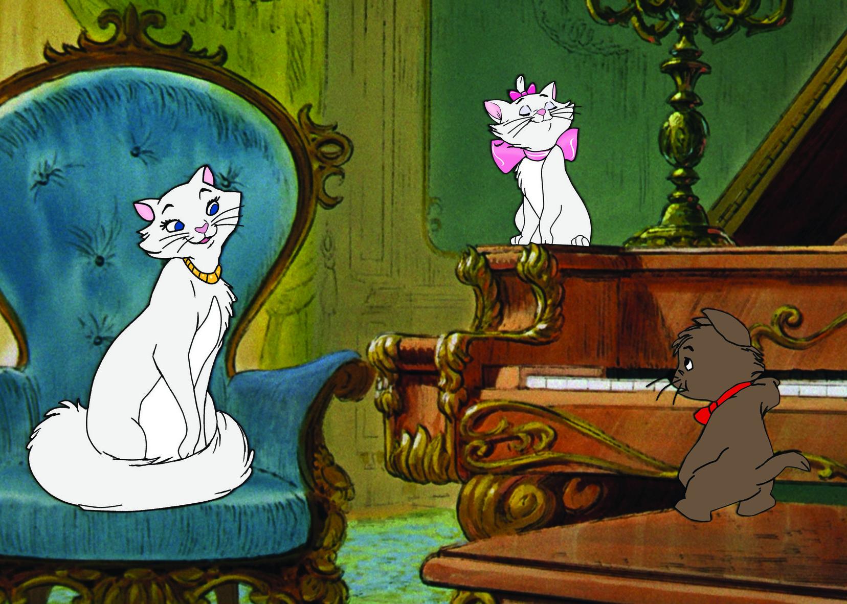 Two white cats listen to a small brown cat play the piano.