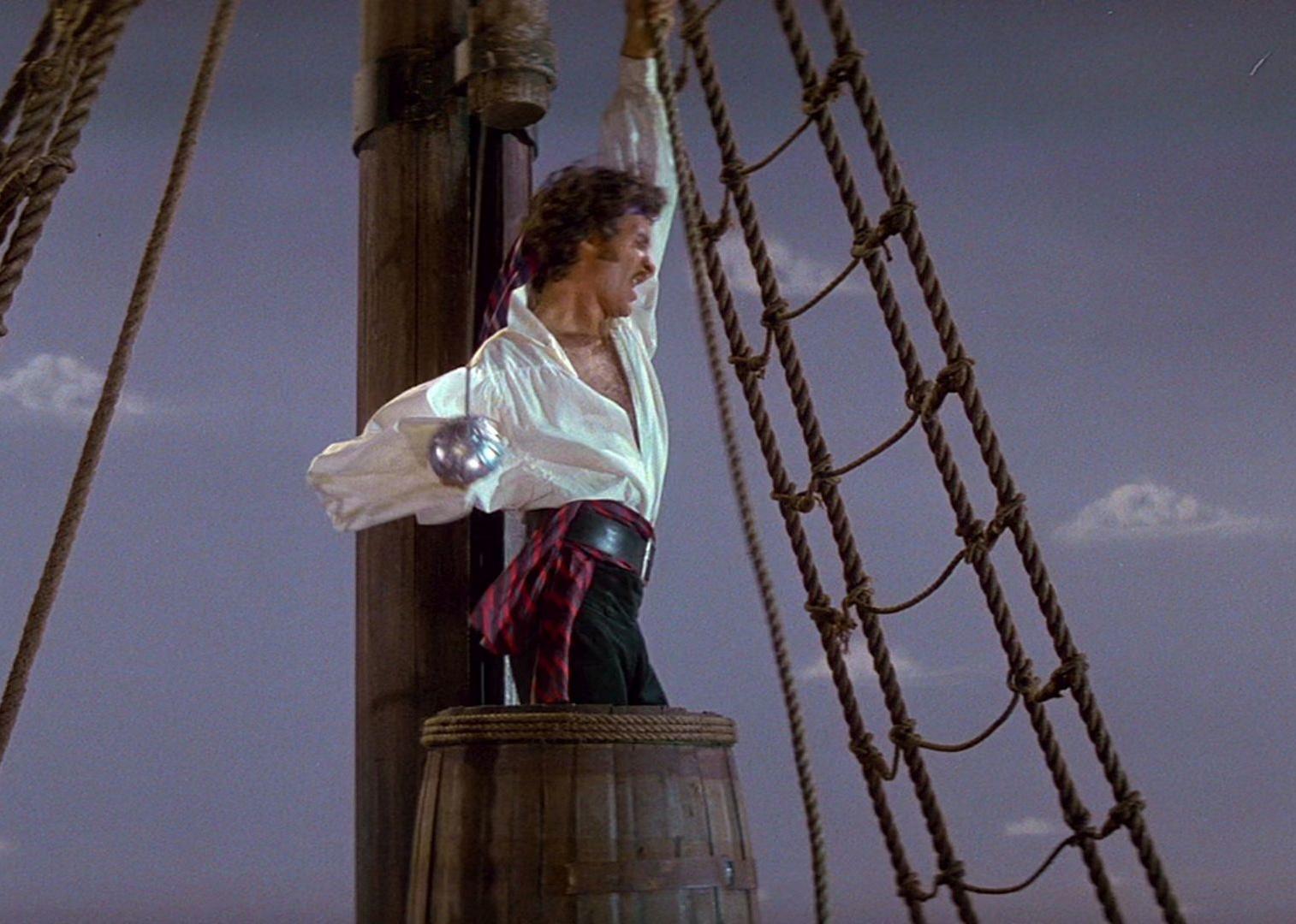 Kevin Kline as a pirate on a ship with a sword.