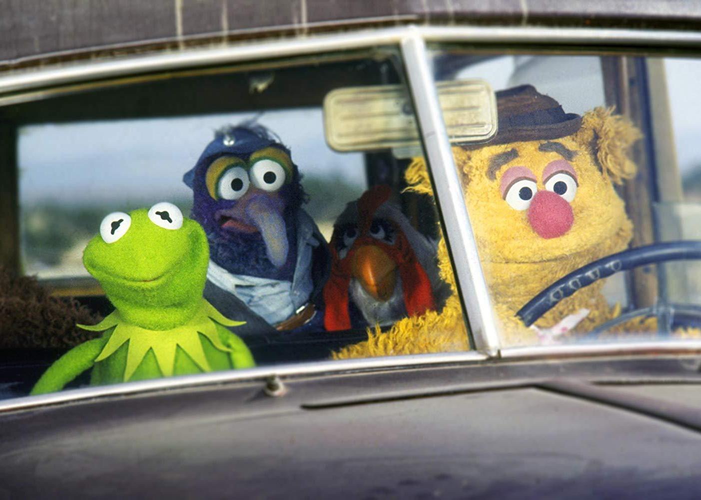 Muppets driving in a car.