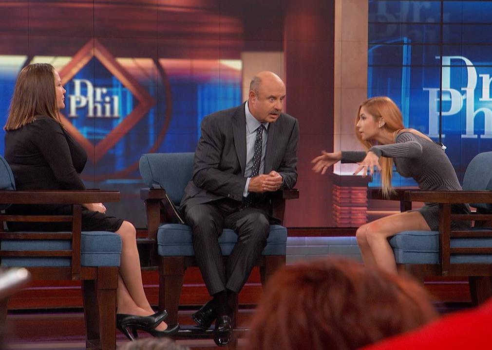 Dr. Phil talks to two women on his show.