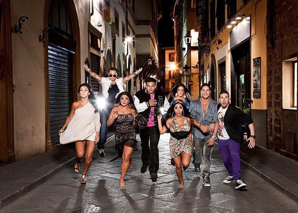 Cast of the Jersey Shore running down a street together.