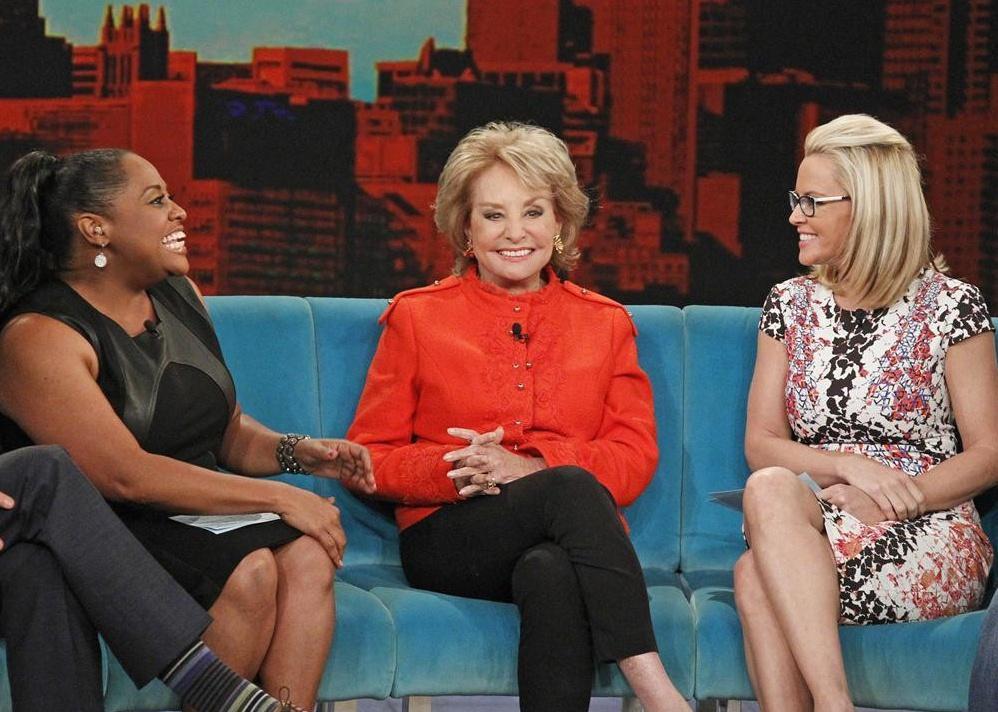 The View hosts sitting on a couch.