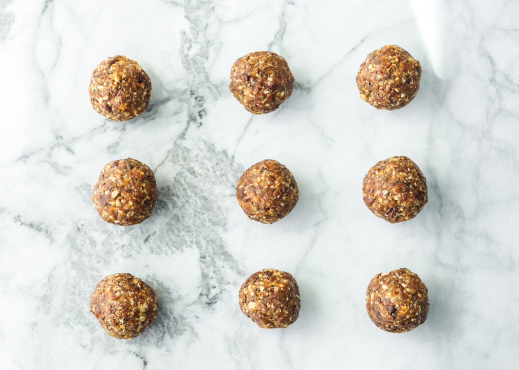 Nut balls on a white marble counter.