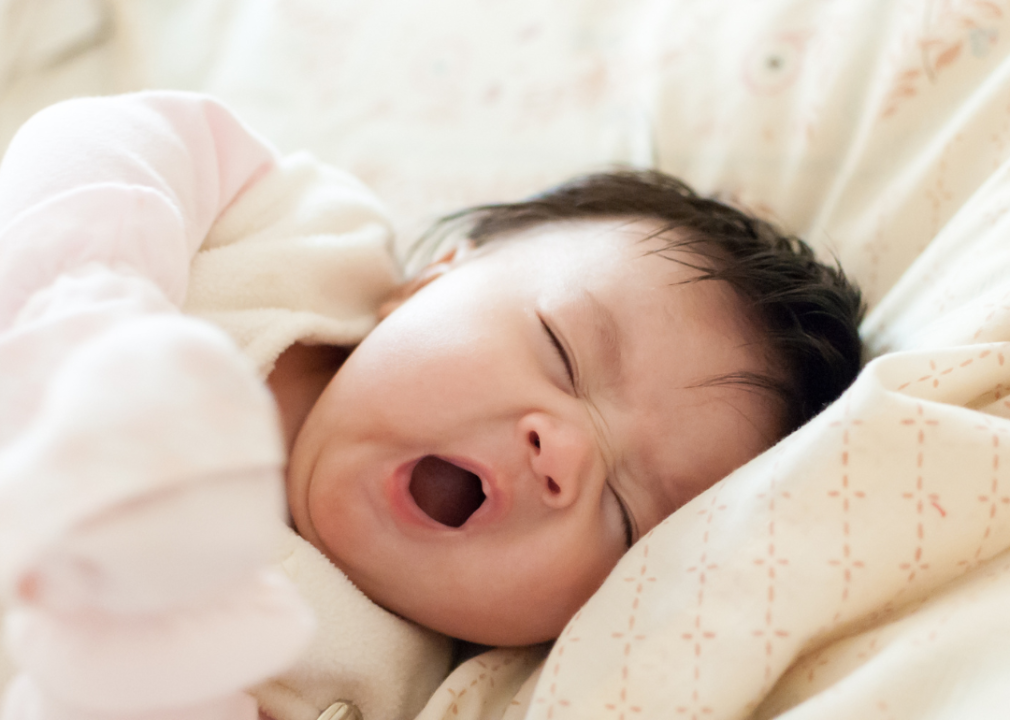 A baby yawning.