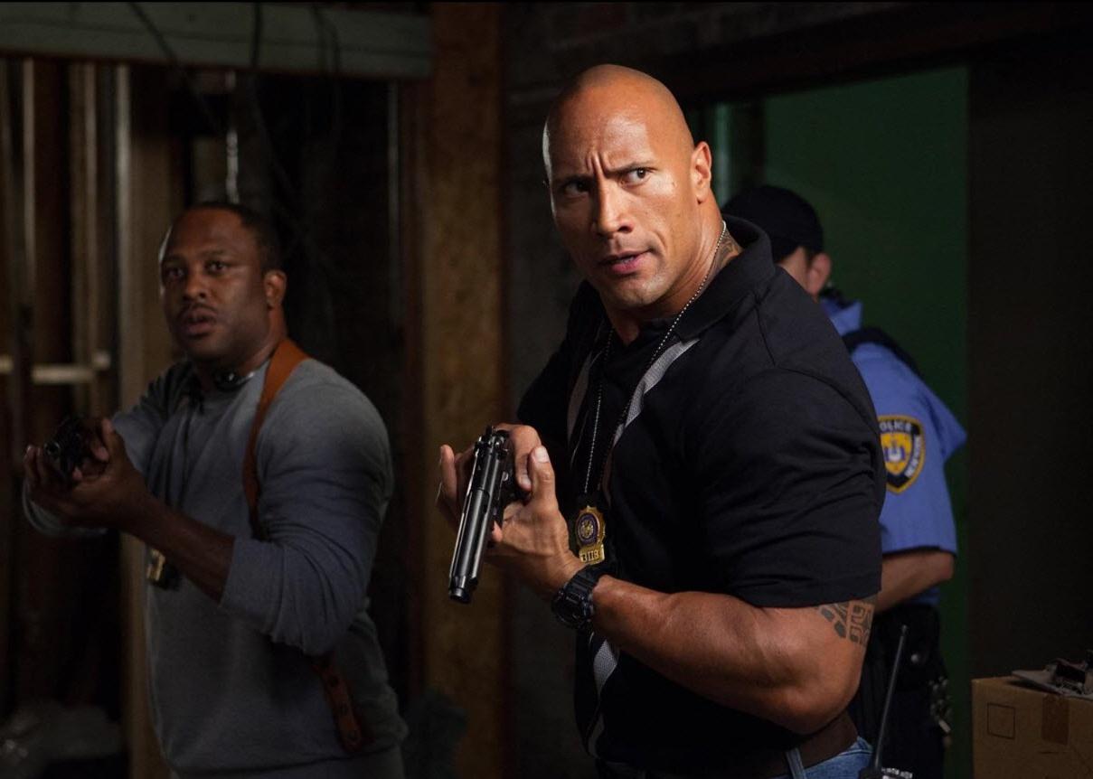 Dwayne Johnson and Lucky Johnson in a scene from "Empire State"