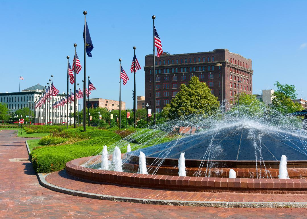 Downtown Omaha water fountain and American Flags.