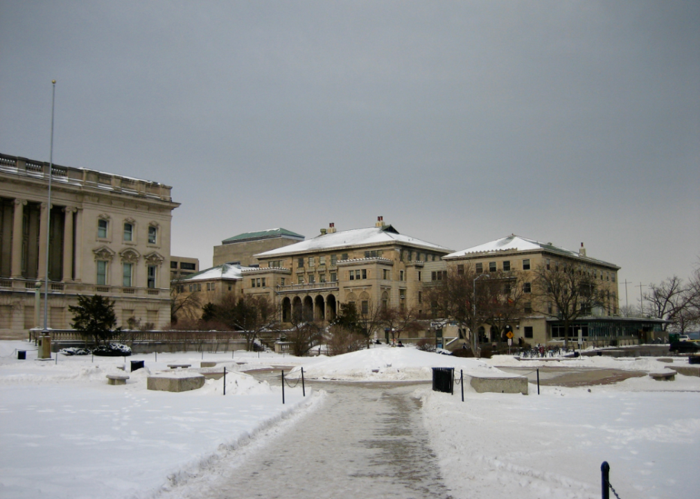 Stately buildings on a college campus covered in snow.