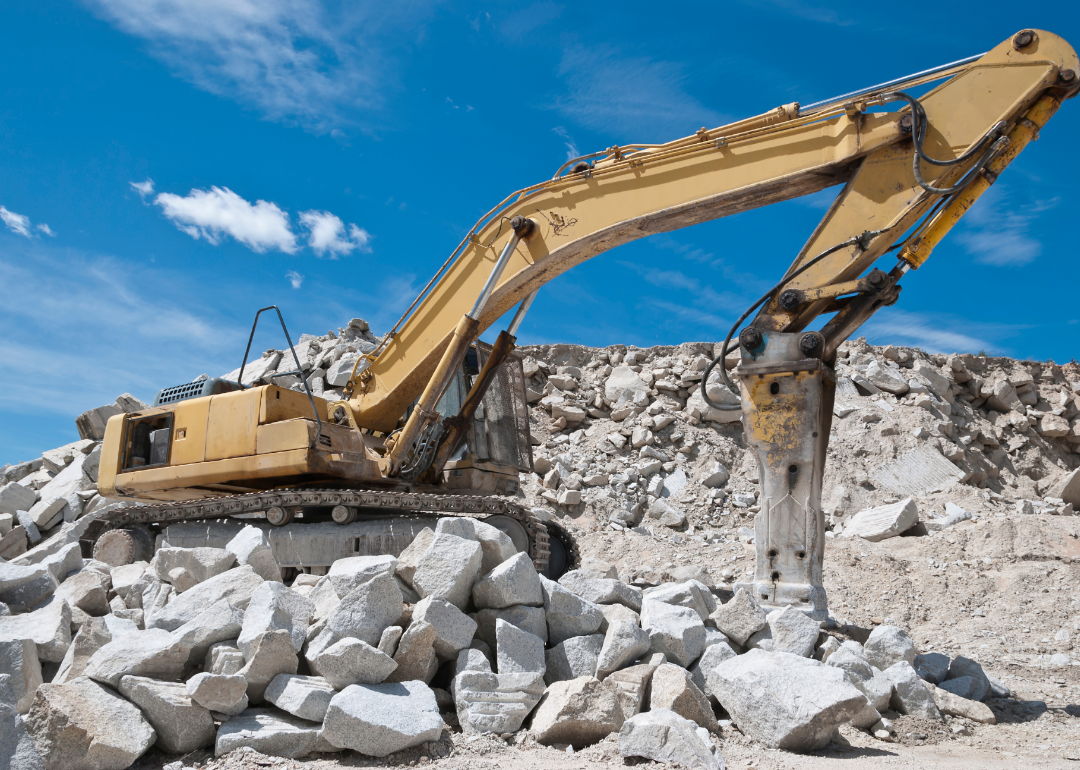 Rock splitter uses heavy machinery at a quarry