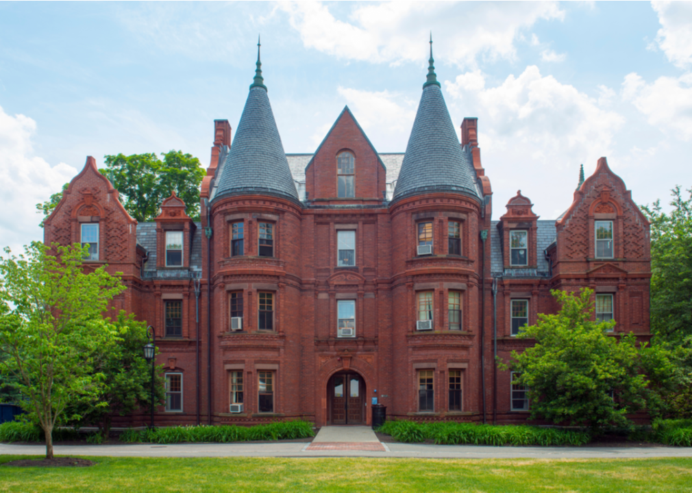 An ornate, red brick building on the Wellesley College campus.