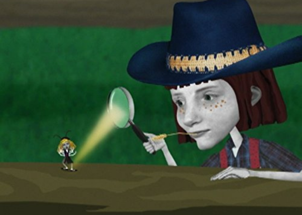 A cartoon of a girl wearing a cowboy hat using a magnifying glass to shine light on a girl insect.