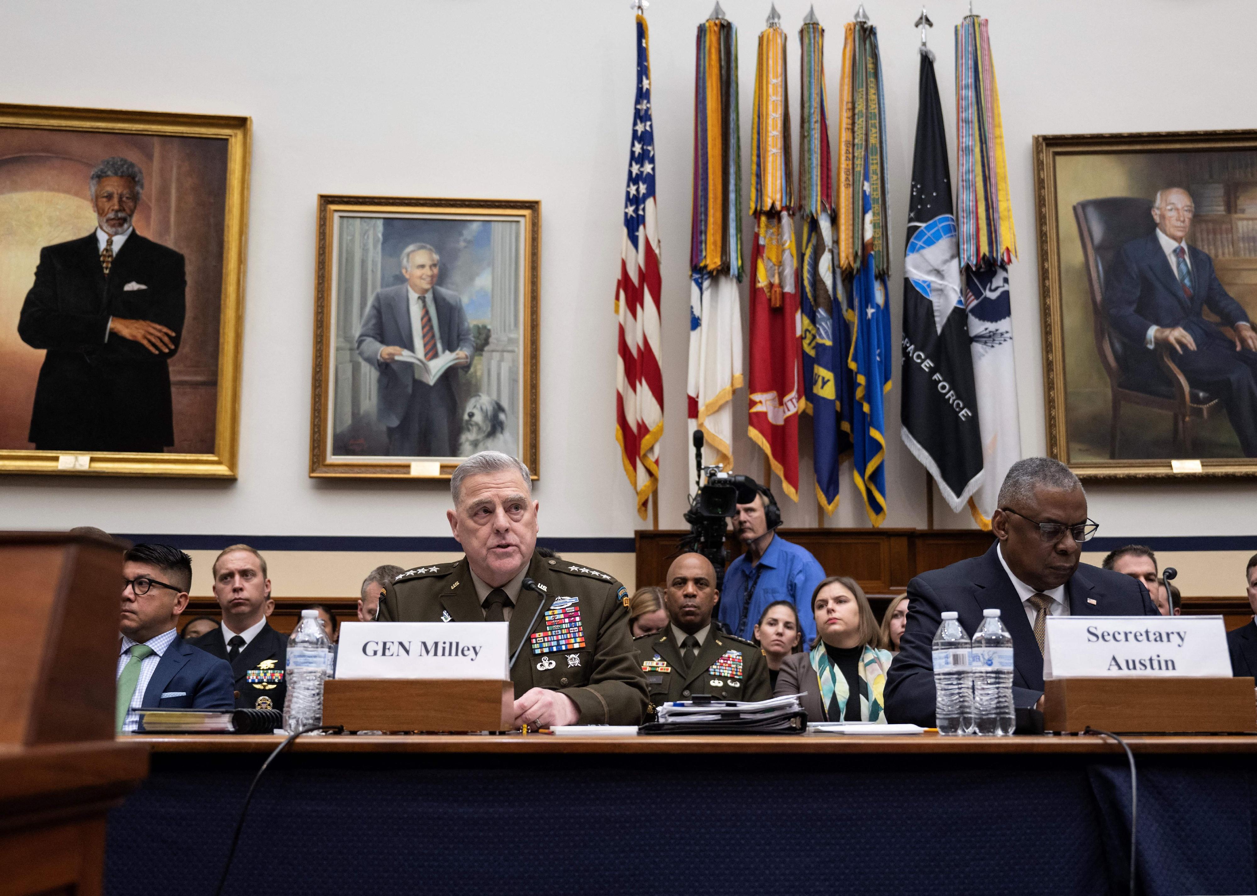 US General Mark Milley, Chairman of the Joint Chiefs of Staff, speaks as US Defense Secretary Lloyd Austin looks on in Washington.
