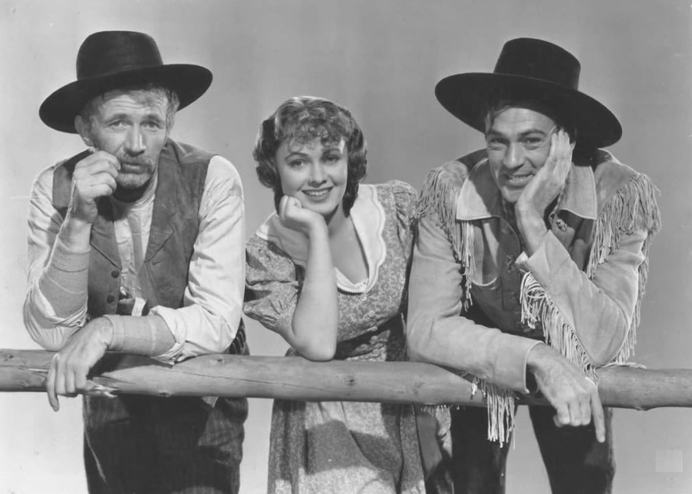 Gary Cooper, Walter Brennan, and Doris Davenport in "The Westerner"