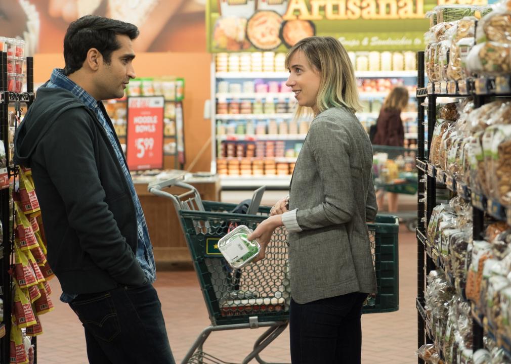 A man and woman talking in a grocery store.