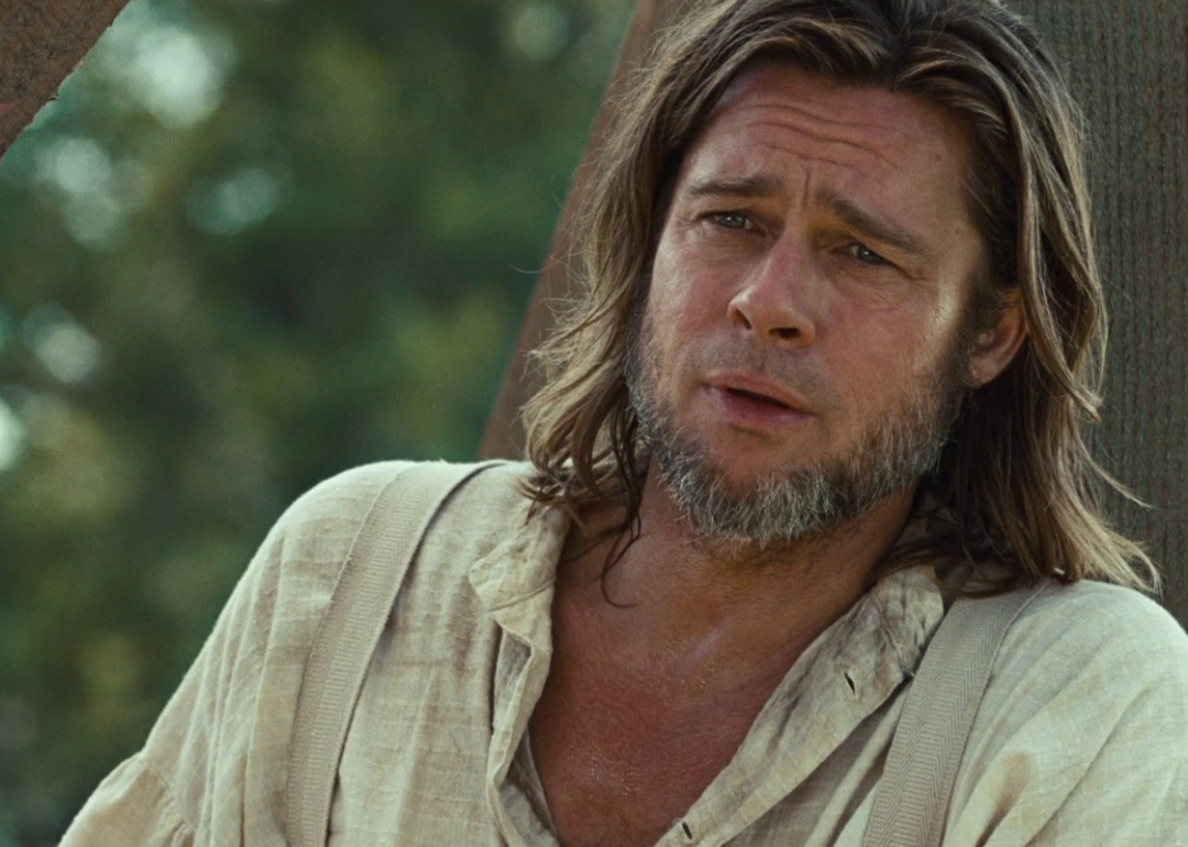Brad Pitt with long hair and a beard.