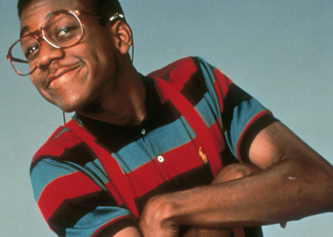 Jaleel White in a striped shirt and suspenders.