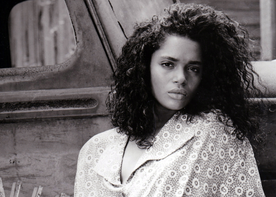 Lisa Bonet posing in front of a classic truck.